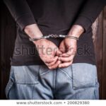 man-hands-handcuffs-450w-200829380