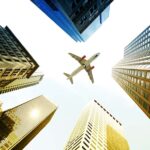 Airplane flying over Boston skyscrapers